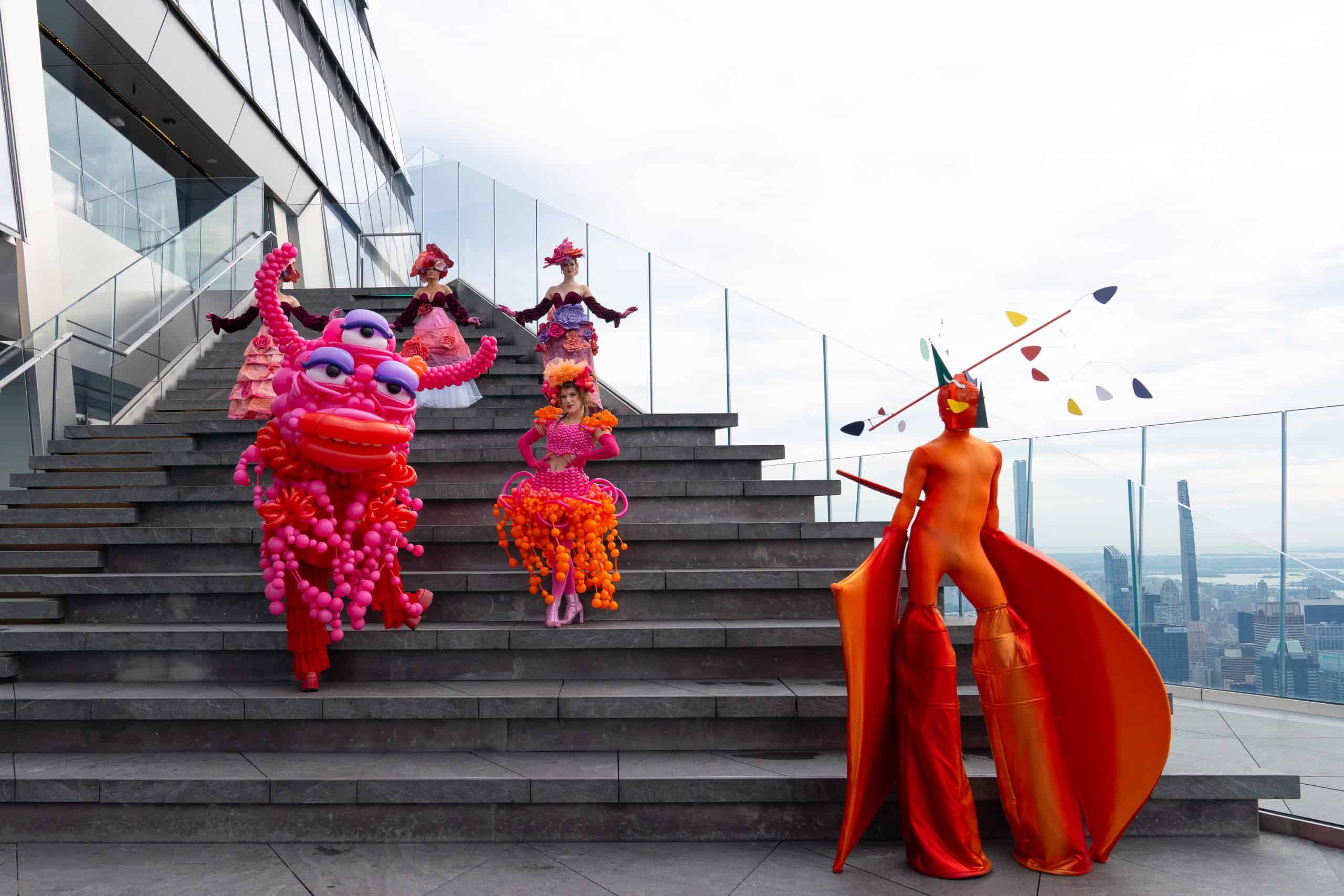 performers dressed in costumes for the garden of shadows at The Edge NYC outside on steps