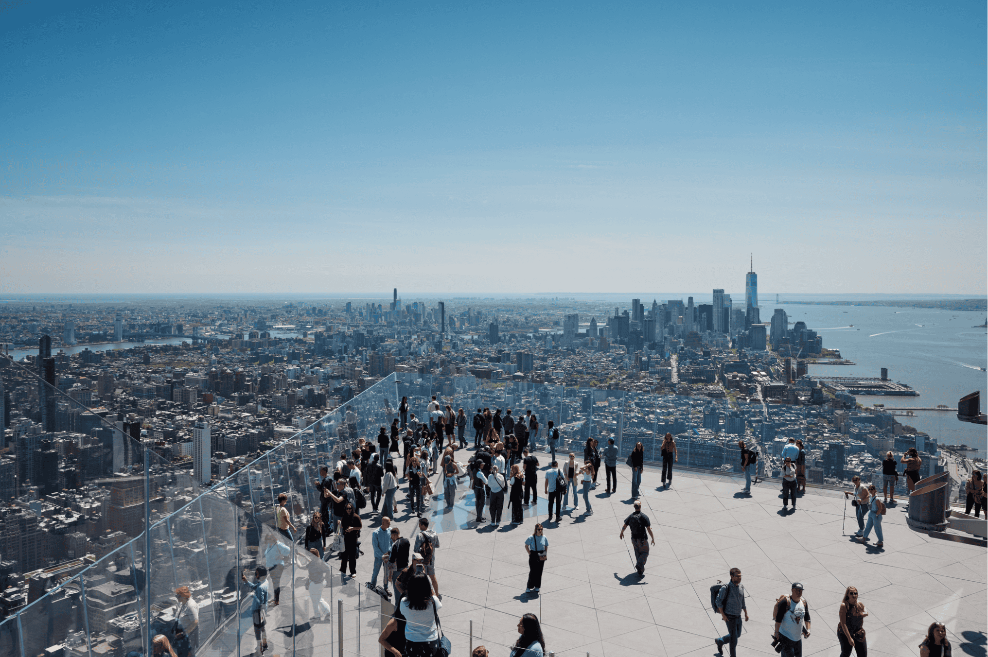 a group of people looking at NYC skyline during the day from The Edge NYC